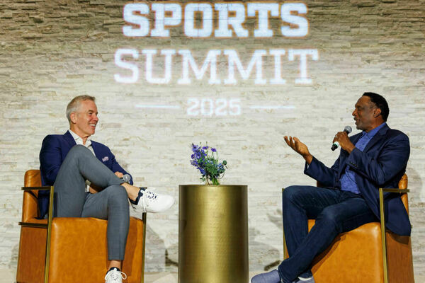 Two men taking part in an interview during Sports Summit 2025