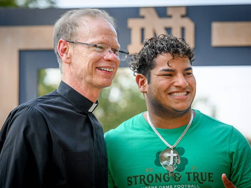 Fr. Bob smiling with ND Student