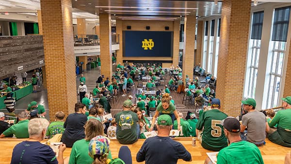 A wide view of the Midfield Commons at Duncan Student Center full of giving society members at the Shake Down the Thunder tailgate